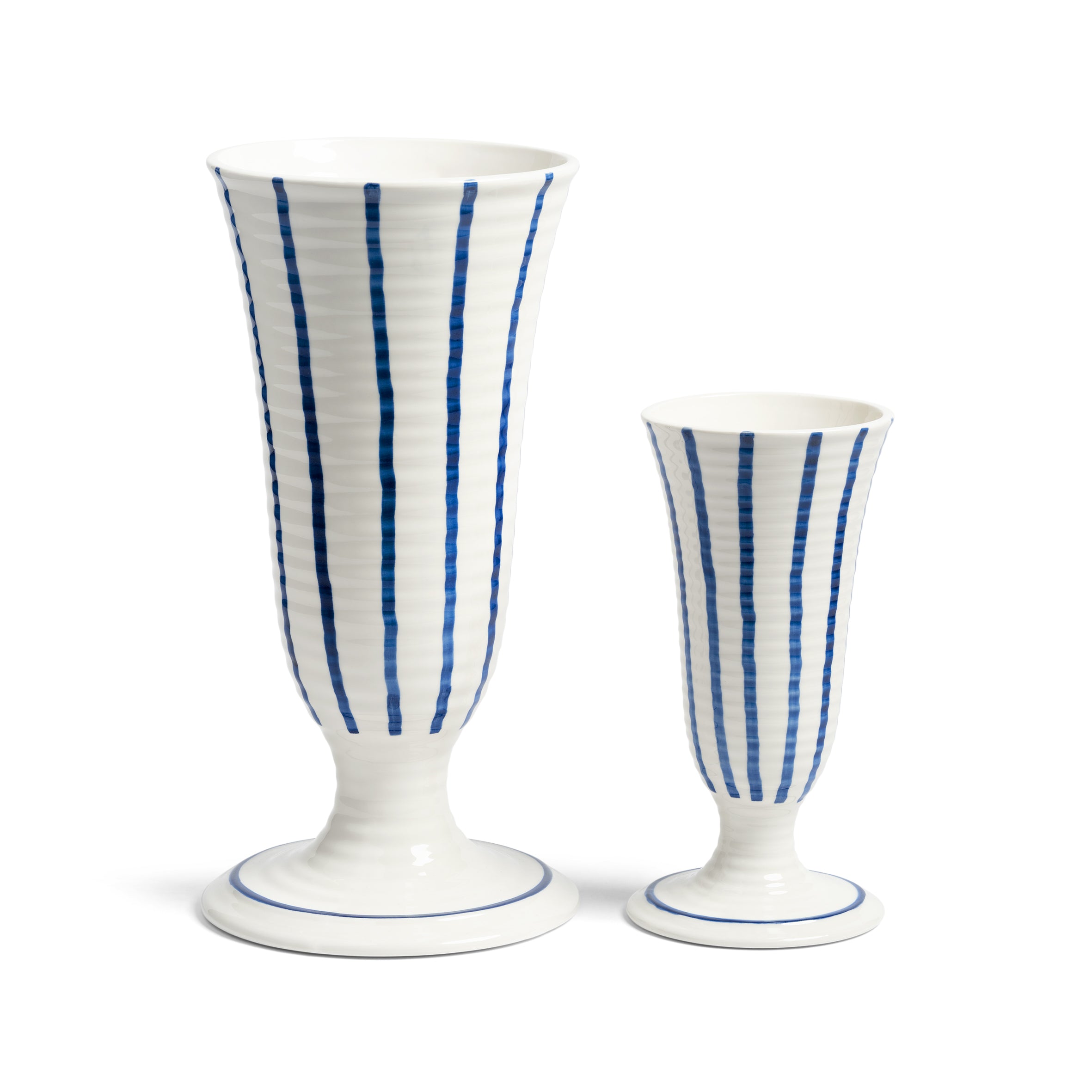 Two white ceramic vases with blue stripes on a white background