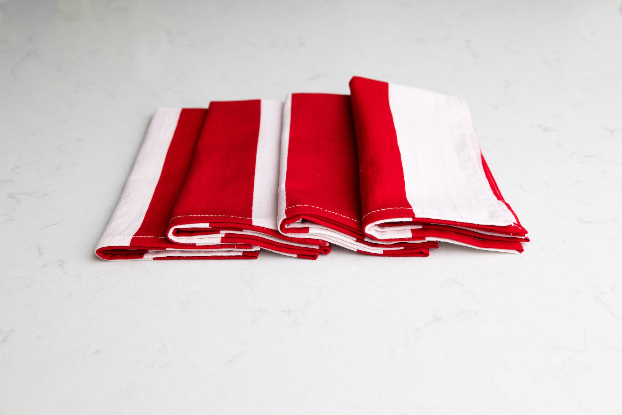 Set of four red and white striped napkins