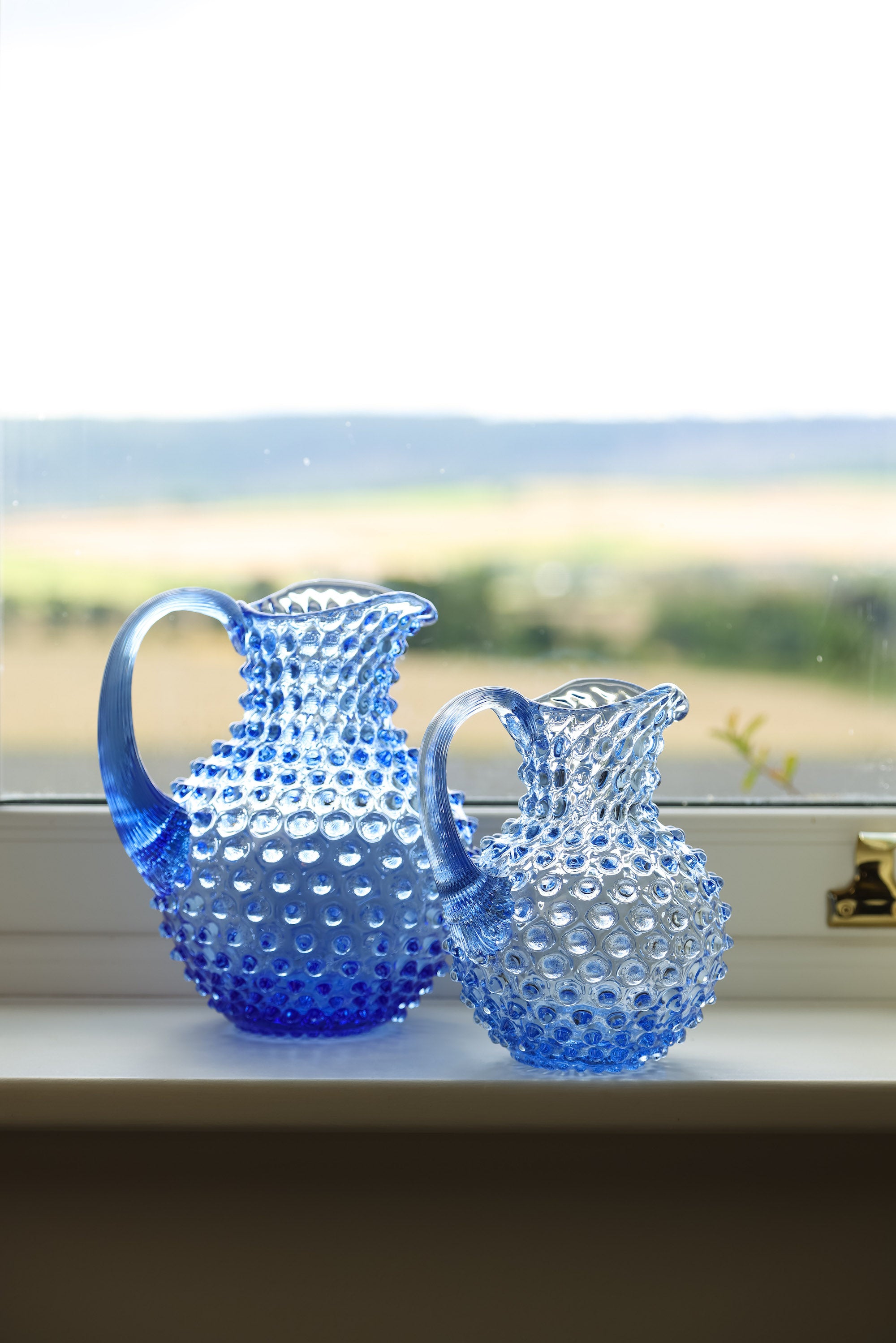 Small light blue hobnail jug