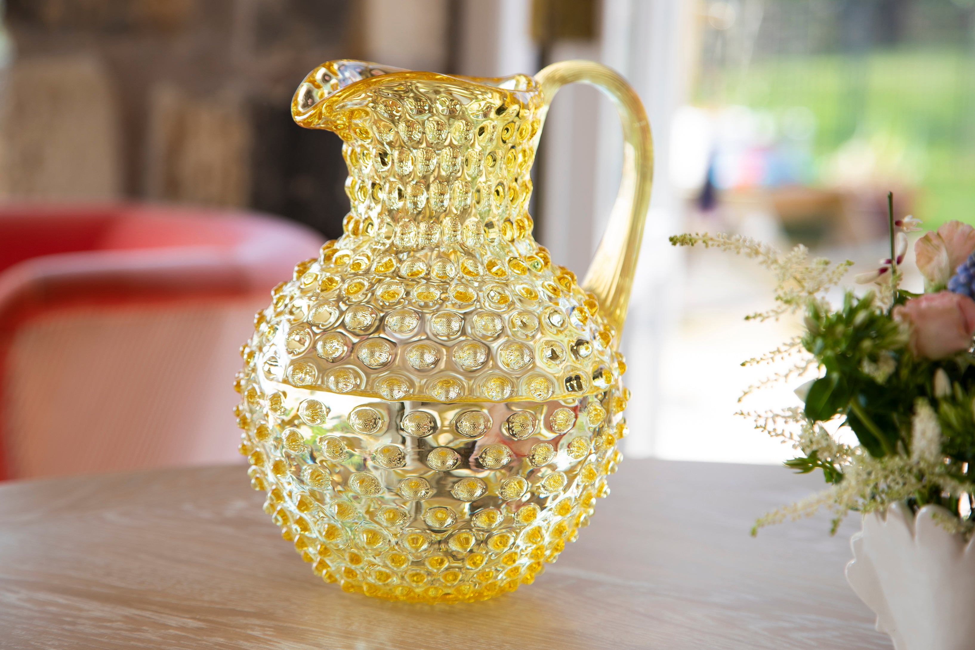 Yellow glass hobnail jug