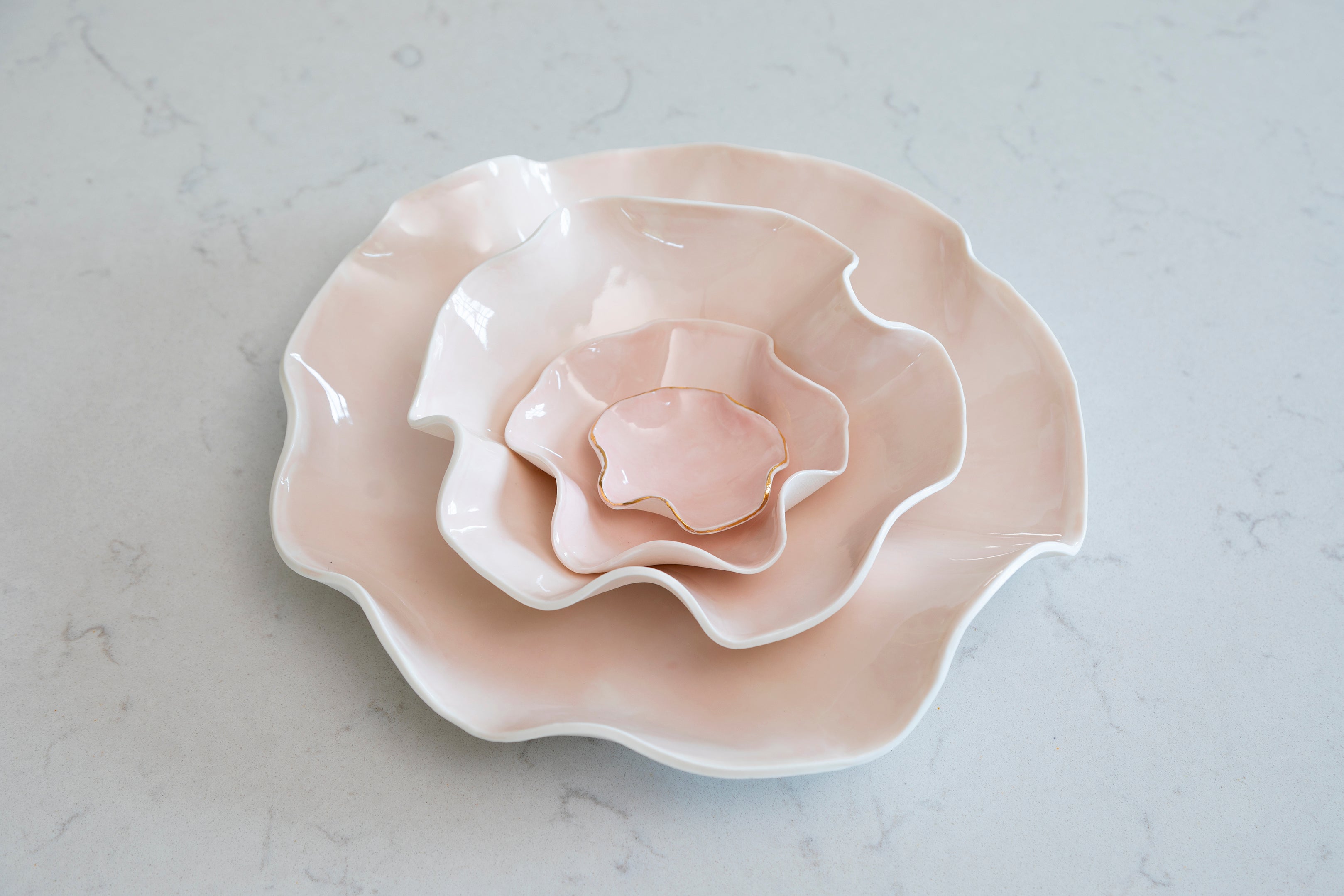 Nest of Pink porcelain Joanna Ling wave bowls, various sizes