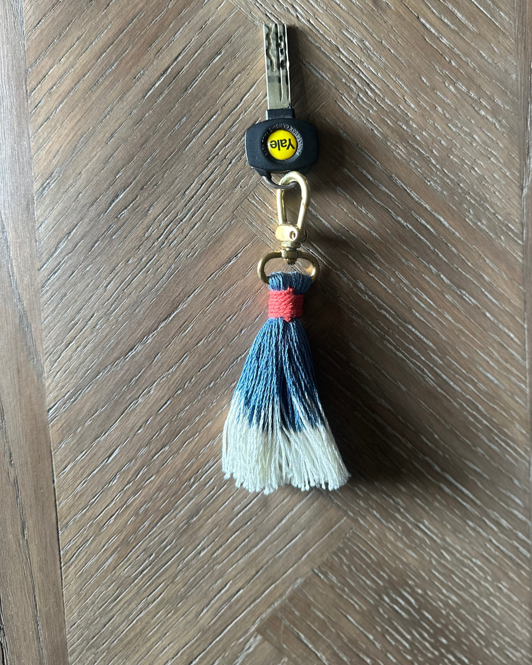 Blue key ring with a tassel