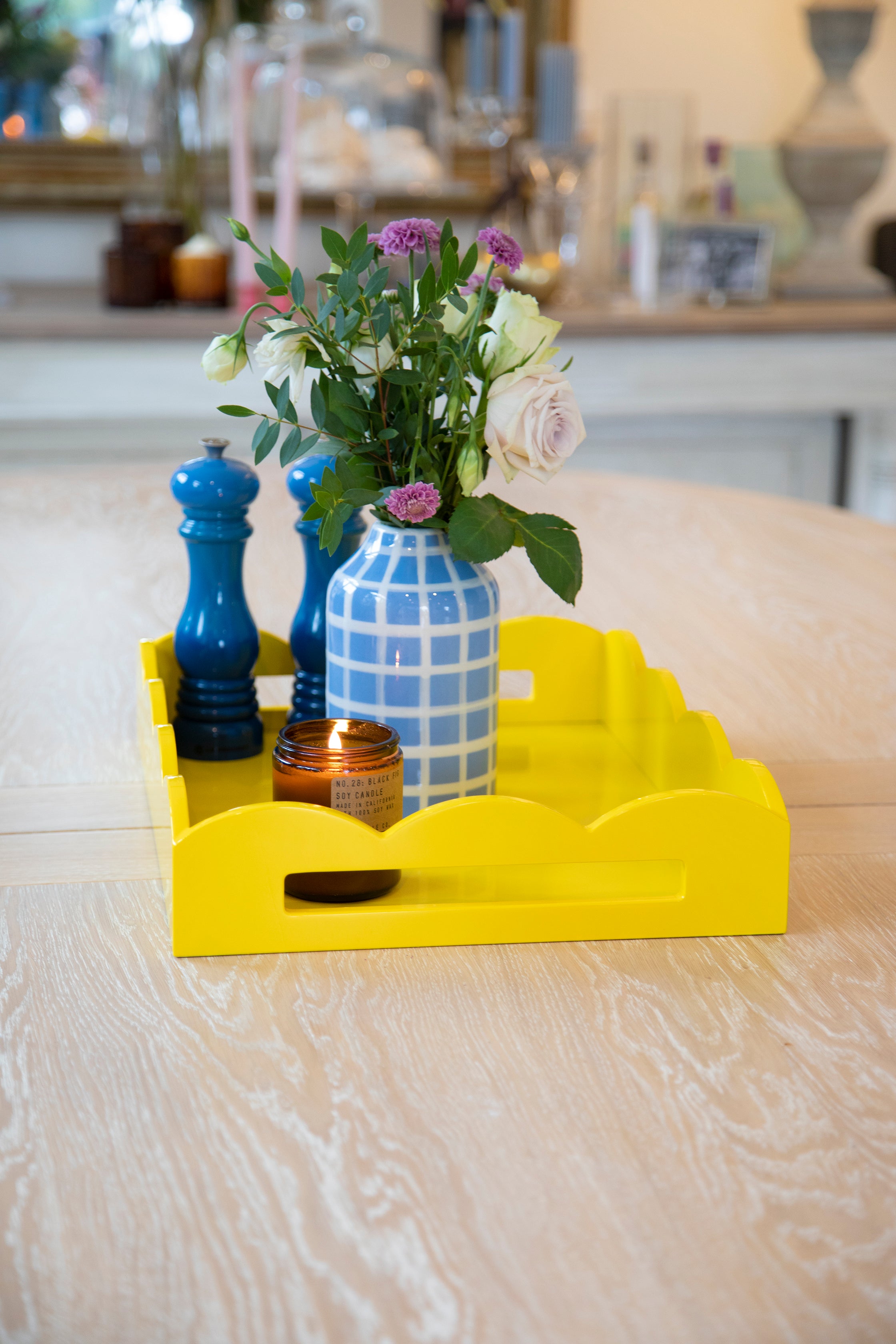 blue vase on a yellow tray