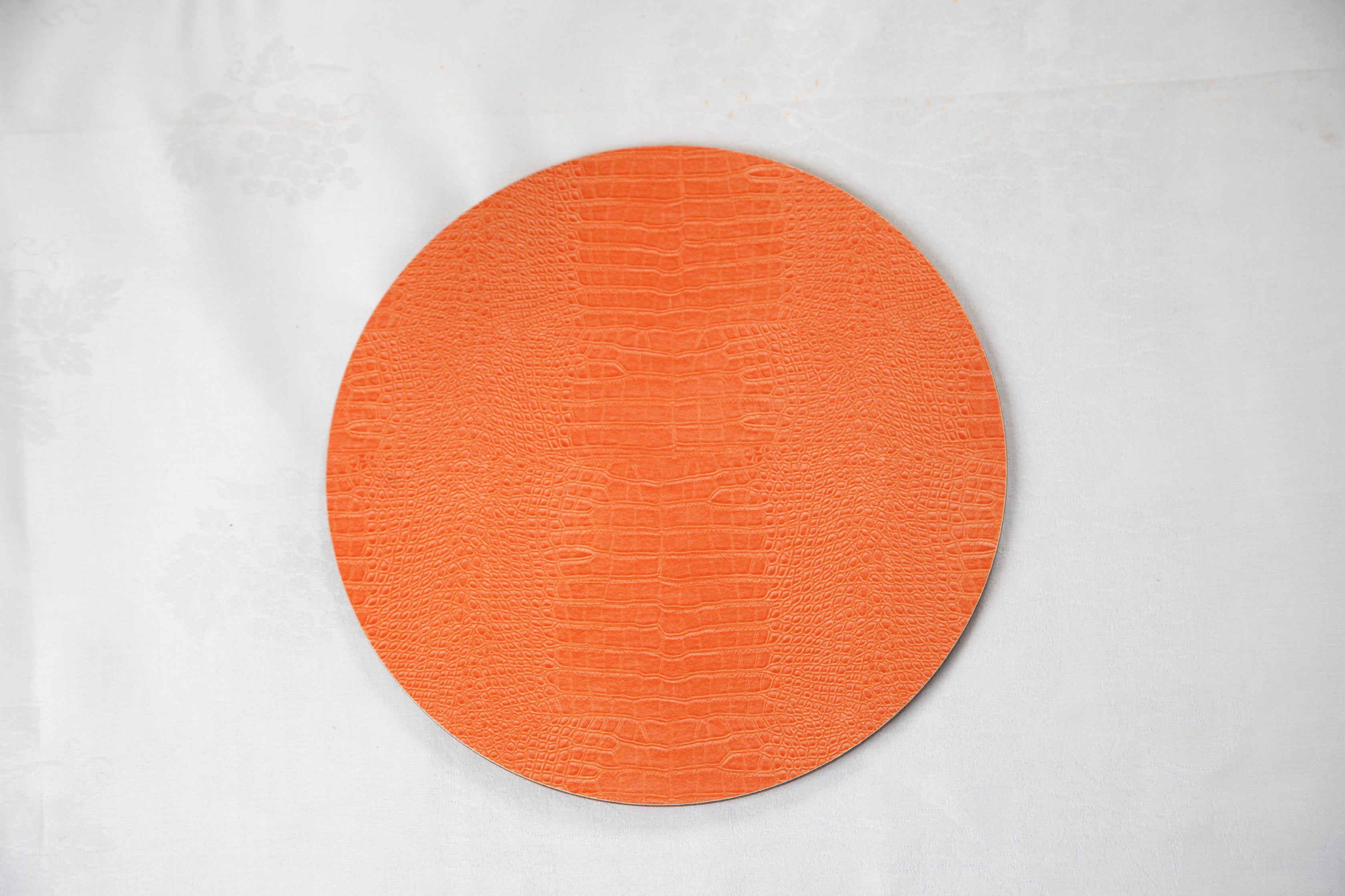 Orange crocodile print round placemat